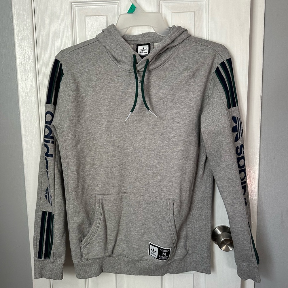 Adidas grey sweatshirt size M with green and blue accent sleeves